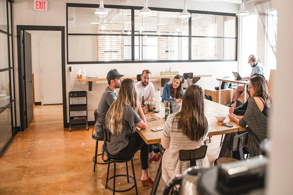 Finance professional presenting sales closing strategies on a laptop in a modern office